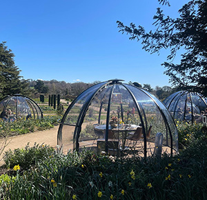Image shows the dining pods on a sunny day at The Trentham Estate